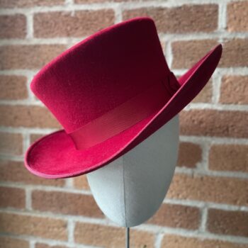 Louise Pocock red felt hat on a stand